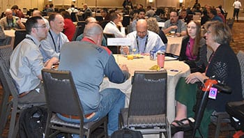 Event participants sitting together at a table