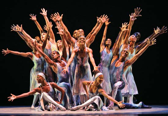Dancers performing on a stage.
