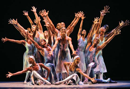 Dancers performing on a stage.
