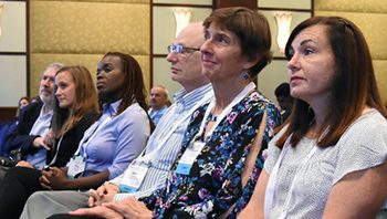 Participants in an Internet2 event listen to a presentation.