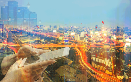 Illustration of someone using a cell phone with a city scape in the background