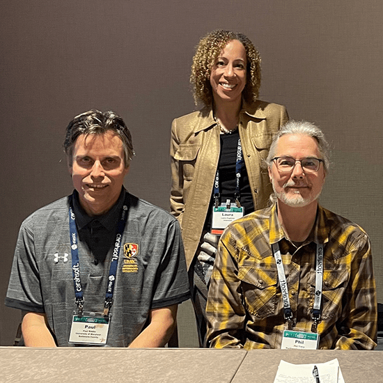 Laura Paglione and panelists Paul Riddle (left) and Phil Tracy